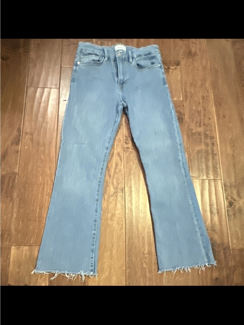 Frame Denim Light Blue Flared Jeans with Frayed Hem